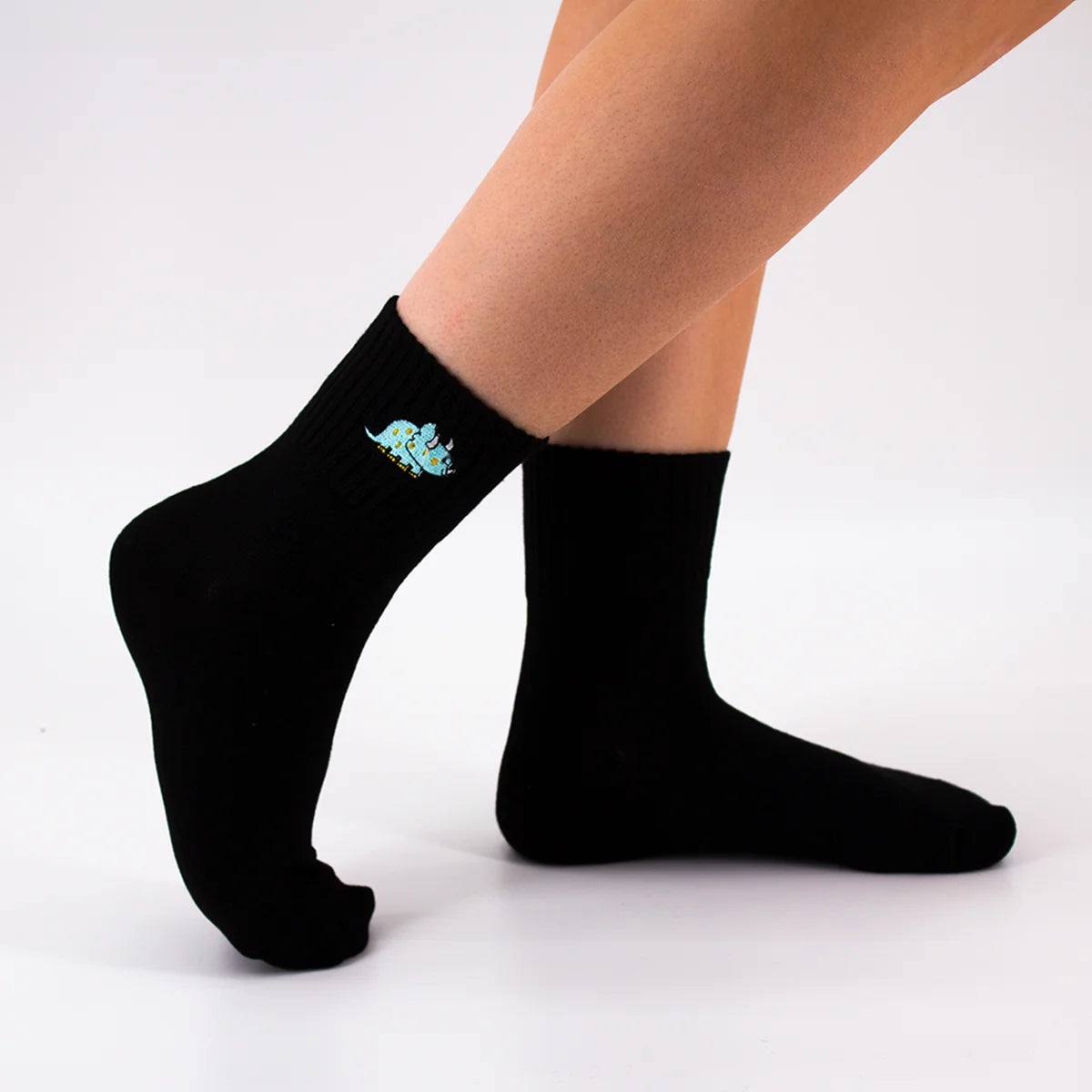 Chaussettes noires en coton à motif dinosaure triceratops