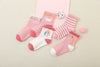 Lot de 5 chaussettes montantes, fond rose ou blanc, motifs variés : rayures, licornes, coeurs. Pour bébé et enfant (du 12 mois au 12 ans).