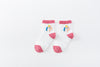 Chaussettes montantes, fond blanc, motif licornes. Pour bébé et enfant (du 12 mois au 12 ans).
