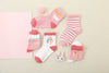 Lot de 5 chaussettes montantes, fond rose ou blanc, motifs variés : rayures, licornes, coeurs. Pour bébé et enfant (du 12 mois au 12 ans).