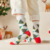 Chaussettes hautes de Noël avec motif sapins. Douces, chaudes et stylées pour un hiver cosy et un look joyeux à Noël.