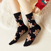 Chaussettes hautes, motif biscuits de Noël. Coloris noir. Douces et Chaudes. Également vendues en lot de 4. Idéales pour offrir.