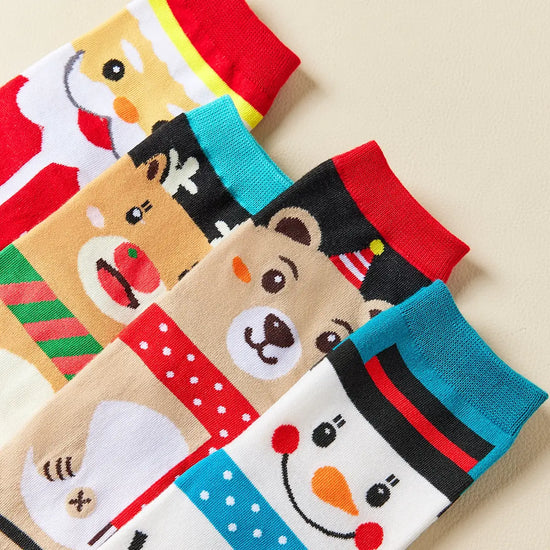 Coffret de 4 chaussettes hautes costume de Noël : Père Noël, Bonhomme de Neige, Renne et Ours