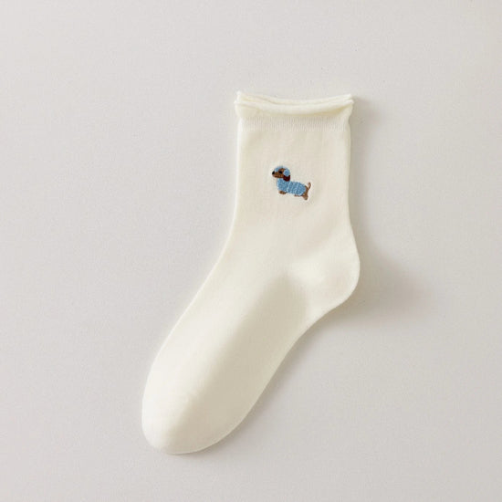 Chaussette femme crème vendue à l’unité avec broderie chien ou chat. Maille douce, bord roulotté et taille unique 35-41. Confort et fantaisie garantis.