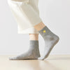 Chaussette haute chaude avec cœur doré brodé.