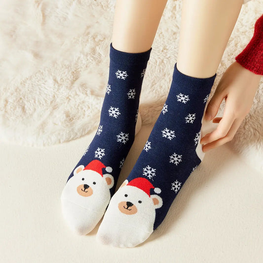 Chaussettes bleu marine de noël motif flocons et tête d'ours portant un bonnet de noël 