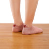 chaussettes roses avec coeur rouge brisé sur la languette