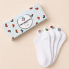 Coffret de 4 chaussettes blanches motif de noël, languette brodée : Père Noël, bonhomme de neige, flocon, sapin 