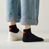 Chaussette mi-haute avec cœur rouge au talon