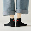 Chaussette mi-haute avec cœur rouge au talon