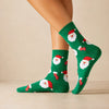 Chaussettes hautes, motifs père noël. Coloris vert festifs. Douces et Chaudes. Également vendues en lot de 4. Idéales pour offrir. 