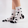 Chaussettes montante, motif peau de vache, tête de vache brodée sur le côté 