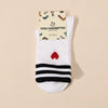 Chaussettes blanches femme à rayures et cœur, vendues à l’unité en noir ou vert. Douces et stretch, taille 35-41, pour un look sportif et tendance.
