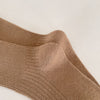 Lot de 4 chaussettes enfant tons neutres avec bord volanté. Confortables et douces, idéales de 12 mois à 12 ans pour un look élégant et discret.

