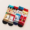 Coffret de 4 chaussettes hautes costume de Noël : Père Noël, Bonhomme de Neige, Renne et Ours