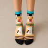 Coffret de 4 chaussettes hautes costume de Noël : Père Noël, Bonhomme de Neige, Renne et Ours