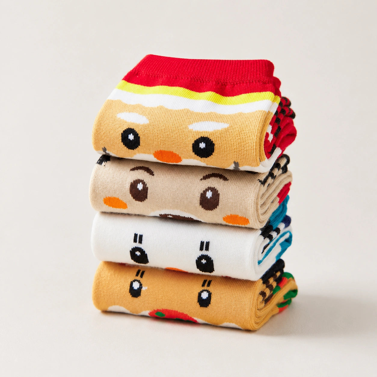 Coffret de 4 chaussettes hautes costume de Noël : Père Noël, Bonhomme de Neige, Renne et Ours