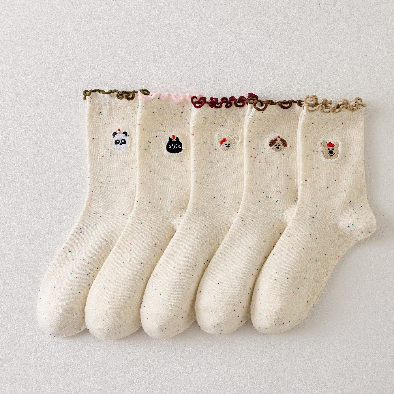 Lot de 5 chaussettes montantes motif animaux avec détail volanté. Coton majoritaire, confortables et festives. Idéales pour un look fun et cosy