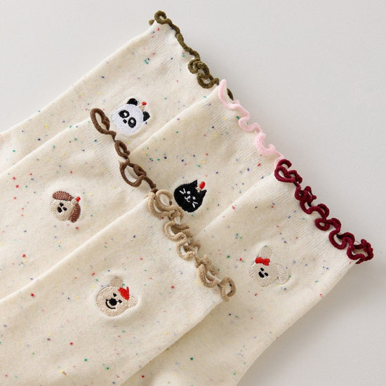 Lot de 5 chaussettes montantes motif animaux avec détail volanté. Coton majoritaire, confortables et festives. Idéales pour un look fun et cosy