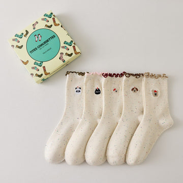 Lot de 5 chaussettes montantes motif animaux avec détail volanté. Coton majoritaire, confortables et festives. Idéales pour un look fun et cosy