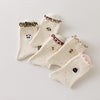Lot de 5 chaussettes montantes motif animaux avec détail volanté. Coton majoritaire, confortables et festives. Idéales pour un look fun et cosy