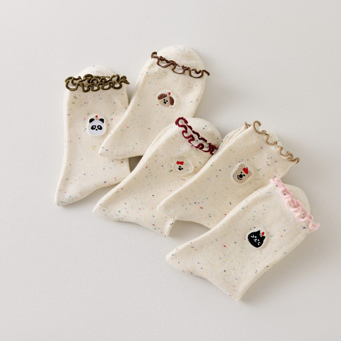 Lot de 5 chaussettes montantes motif animaux avec détail volanté. Coton majoritaire, confortables et festives. Idéales pour un look fun et cosy
