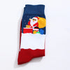 Chaussettes de Noël homme vendues à l’unité. Trois modèles festifs au choix : Père Noël, bonhomme de neige ou rouge décoré. Taille 38-45, confortables.