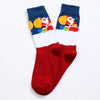 Chaussettes de Noël homme vendues à l’unité. Trois modèles festifs au choix : Père Noël, bonhomme de neige ou rouge décoré. Taille 38-45, confortables.