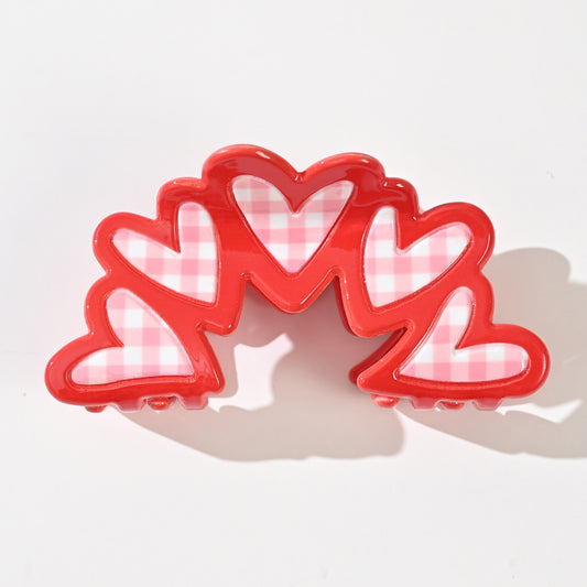 Barrette vichy cœur en acétate de 9 cm. Accessoire cheveux élégant et tendance offrant un excellent maintien, idéal pour offrir ou se faire plaisir.