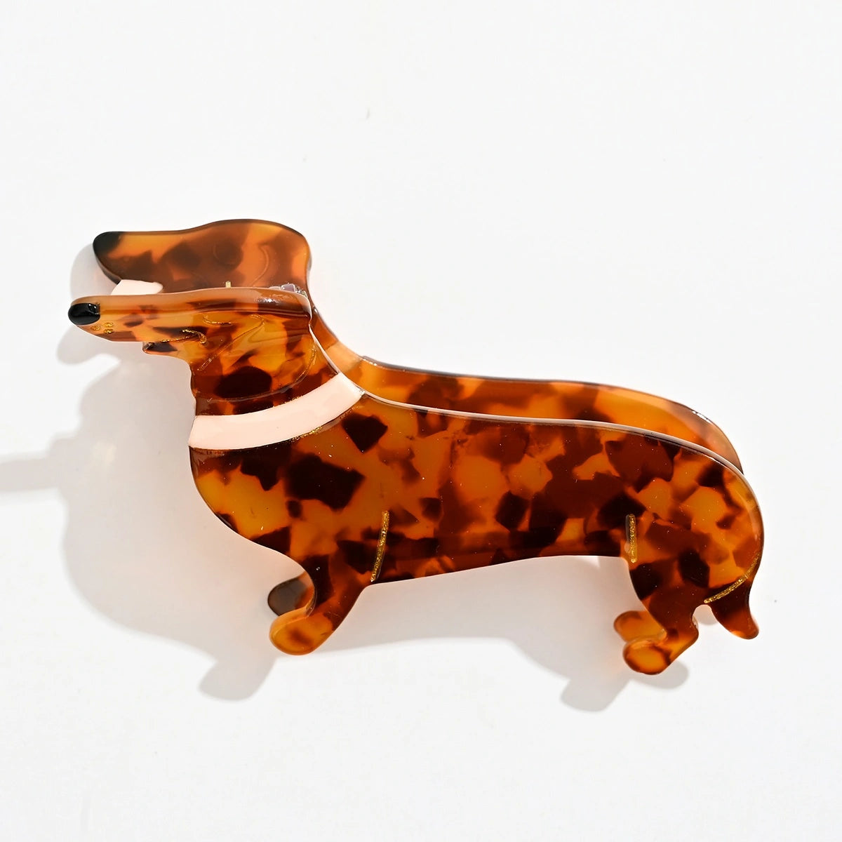 Pince cheveux chien en acétate écaille 9,5 cm. Accessoire coiffure original et tendance, idéal pour cheveux mi-longs à longs, maintien confortable.
